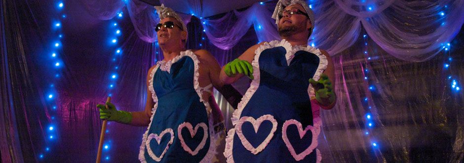 Men dressed as cleaners at a Cabaret performance