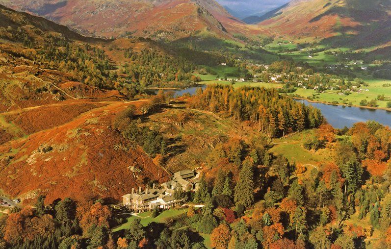 An aerial view of High Close in autumn colours showing Grasmere beyond